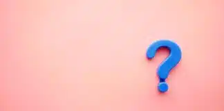 a blue question mark on a pink background